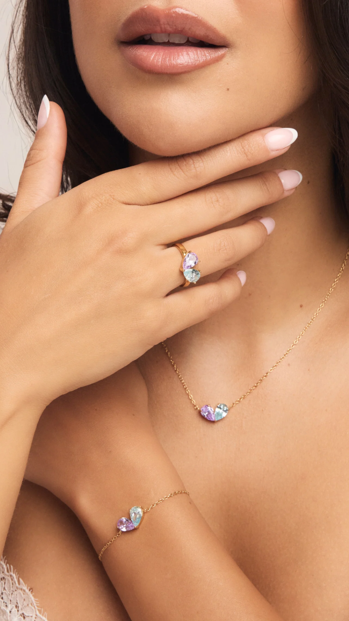 Chérie birthstone heart necklace with two pear-cut stones on a gold chain